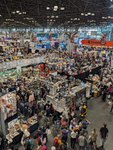 Overhead view of the exhibition hall at Anime NYC 2025, Javits Center