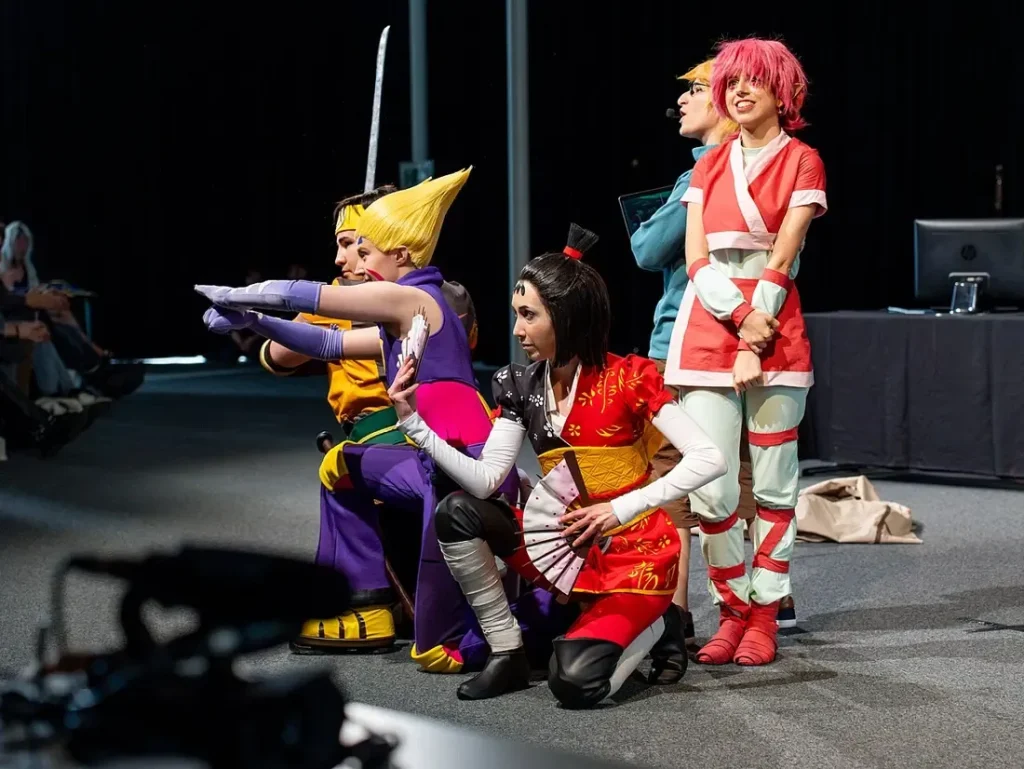 Cosplay group posing on stage